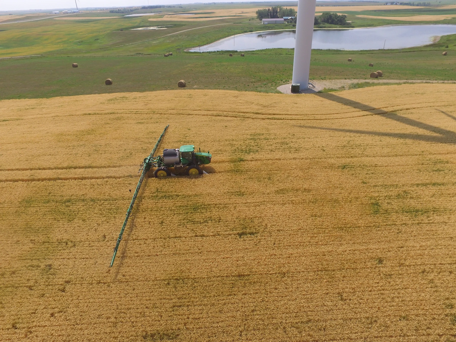 A large combine type tractor spraying a field