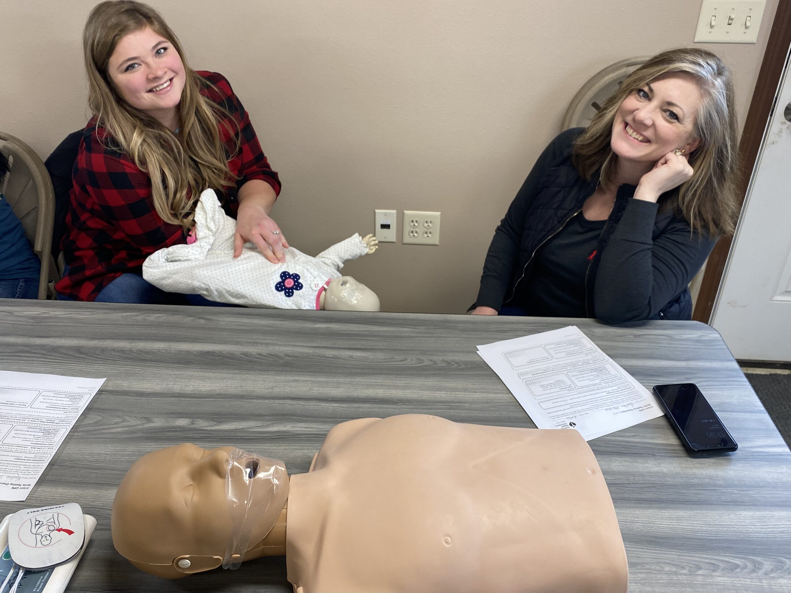 Kristine and Heather learning CPR